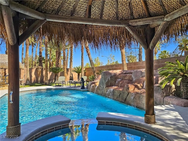 5445 Pendini Point Ct, Las Vegas, NV 89141 - view of swimming pool with a fenced backyard and a pool with connected hot tub