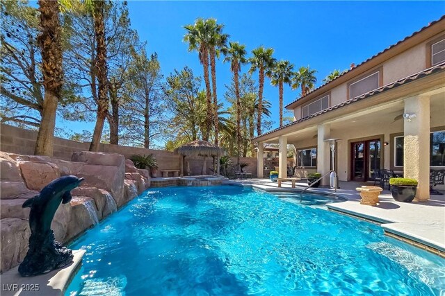 5445 Pendini Point Ct, Las Vegas, NV 89141 - view of pool with a fenced backyard, a patio area, french doors, and a pool with connected hot tub