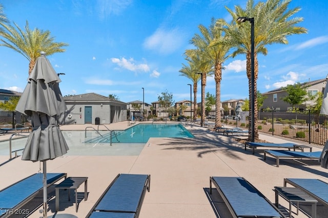 3709 Neblina Dr, Henderson, NV 89052 - community pool with fence, a residential view, and a patio area