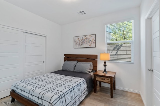 3709 Neblina Dr, Henderson, NV 89052 - bedroom featuring light wood-type flooring, baseboards, and a closet