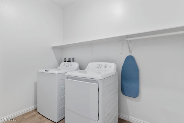 3709 Neblina Dr, Henderson, NV 89052 - washroom with washing machine and clothes dryer, light wood-type flooring, and baseboards