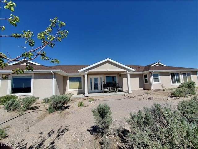 5272 Truman Ln, Caliente, NV 89008 - back of property featuring stucco siding and roof with shingles