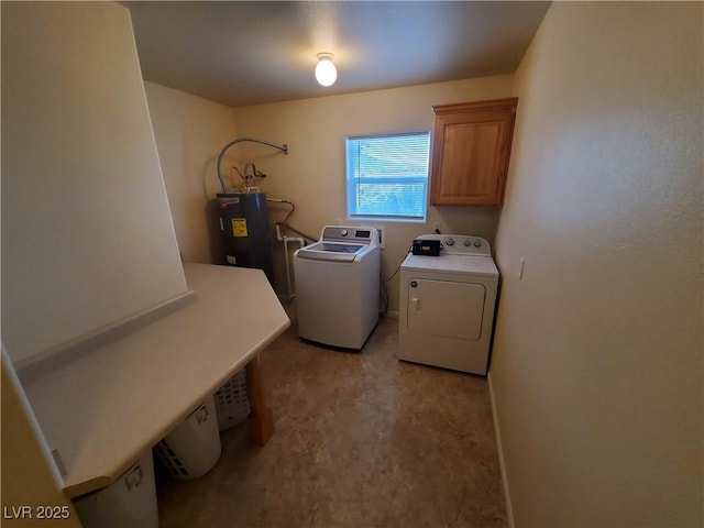 5272 Truman Ln, Caliente, NV 89008 - laundry room featuring water heater, washing machine and clothes dryer, and cabinet space