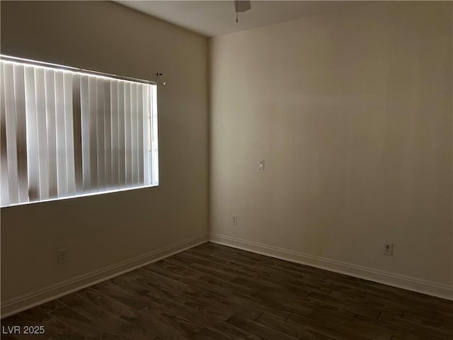 5170 S Jones Blvd Unit 108, Las Vegas, NV 89118 - spare room featuring dark wood-style flooring, baseboards, and a ceiling fan