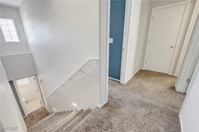 9065 Adorable Ave, Las Vegas, NV 89149 - hallway featuring carpet floors, an upstairs landing, and baseboards