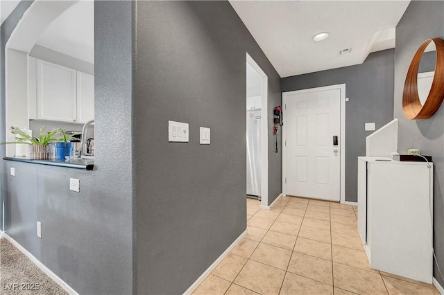 9065 Adorable Ave, Las Vegas, NV 89149 - hallway featuring light tile patterned flooring, baseboards, and arched walkways