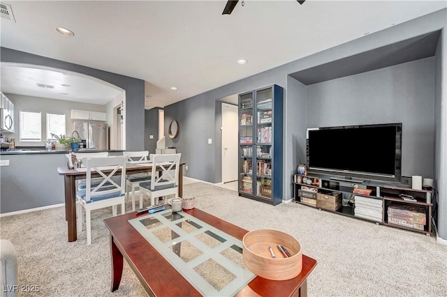 9065 Adorable Ave, Las Vegas, NV 89149 - carpeted living room with arched walkways, recessed lighting, ceiling fan, and baseboards