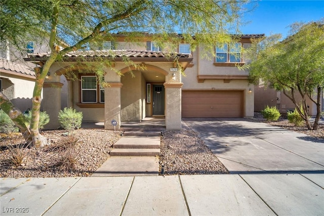 7520 Fontera Ct, Las Vegas, NV 89139 - mediterranean / spanish-style home with driveway, an attached garage, stucco siding, and a tiled roof