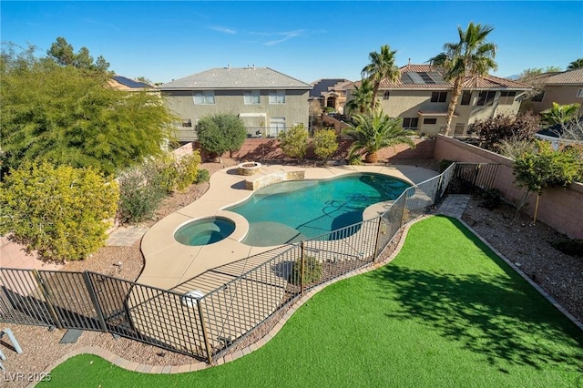 7520 Fontera Ct, Las Vegas, NV 89139 - view of swimming pool with a fenced backyard, a patio area, a pool with connected hot tub, and a residential view