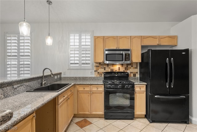 kitchen featuring black appliances, a sink, light brown cabinetry, and light tile patterned flooring