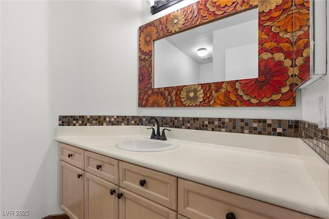 bathroom featuring decorative backsplash and vanity