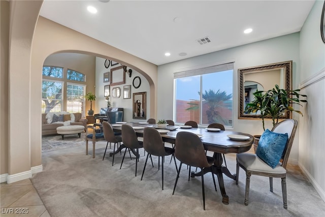 7778 Villa Montara St, Las Vegas, NV 89123 - dining room with arched walkways, plenty of natural light, baseboards, recessed lighting, and light carpet