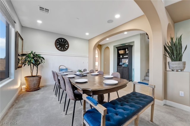 7778 Villa Montara St, Las Vegas, NV 89123 - dining space with arched walkways, light carpet, stairs, recessed lighting, and built in features