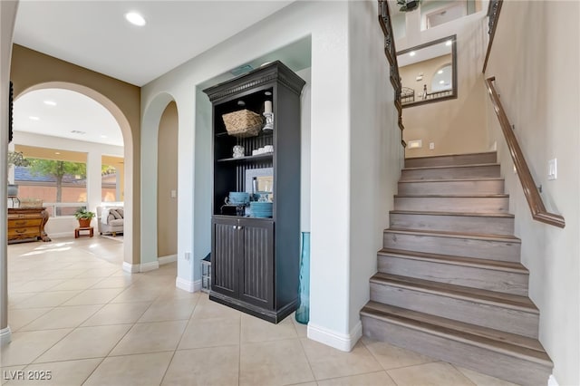7778 Villa Montara St, Las Vegas, NV 89123 - staircase with arched walkways, tile patterned floors, baseboards, and recessed lighting