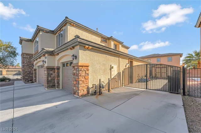 7778 Villa Montara St, Las Vegas, NV 89123 - view of side of property featuring a gate, stone siding, stucco siding, and fence
