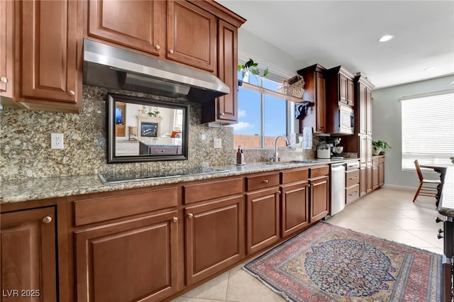 7778 Villa Montara St, Las Vegas, NV 89123 - kitchen featuring under cabinet range hood, appliances with stainless steel finishes, a sink, tasteful backsplash, and recessed lighting