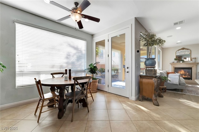 7778 Villa Montara St, Las Vegas, NV 89123 - dining area with healthy amount of natural light, ceiling fan, and light tile patterned flooring
