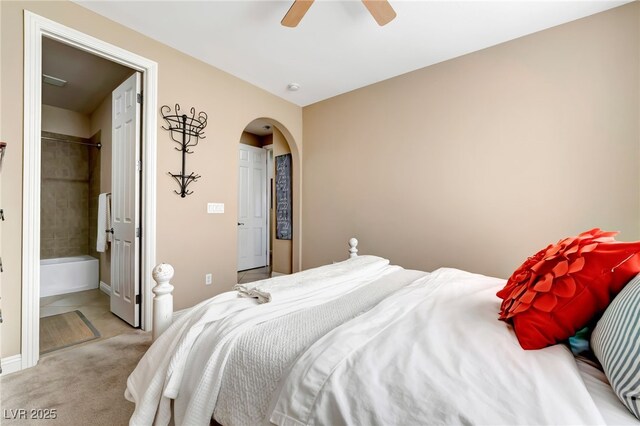 7778 Villa Montara St, Las Vegas, NV 89123 - bedroom with arched walkways, light colored carpet, ceiling fan, and baseboards