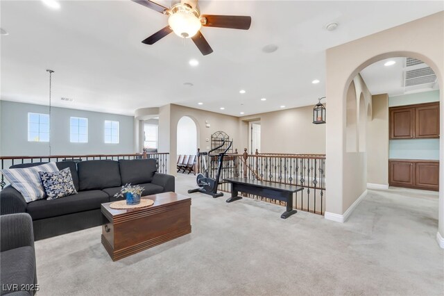 7778 Villa Montara St, Las Vegas, NV 89123 - living room featuring arched walkways, light colored carpet, ceiling fan, recessed lighting, and baseboards