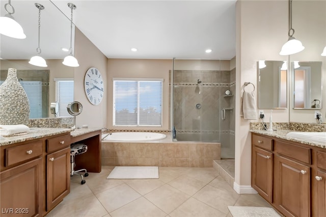 7778 Villa Montara St, Las Vegas, NV 89123 - bathroom with walk in shower, tile patterned flooring, a garden tub, and two vanities