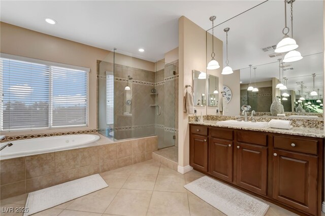 7778 Villa Montara St, Las Vegas, NV 89123 - full bath with tile patterned flooring, a shower stall, a garden tub, and vanity