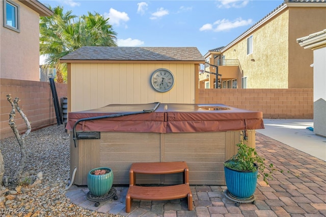 7778 Villa Montara St, Las Vegas, NV 89123 - view of patio / terrace with a hot tub and a fenced backyard