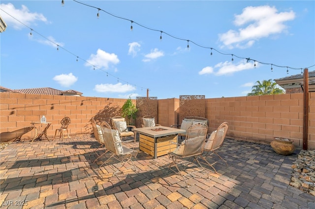 7778 Villa Montara St, Las Vegas, NV 89123 - view of patio with a fire pit and a fenced backyard