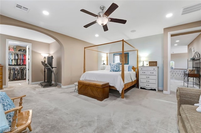 7778 Villa Montara St, Las Vegas, NV 89123 - bedroom featuring arched walkways, light colored carpet, baseboards, recessed lighting, and ceiling fan