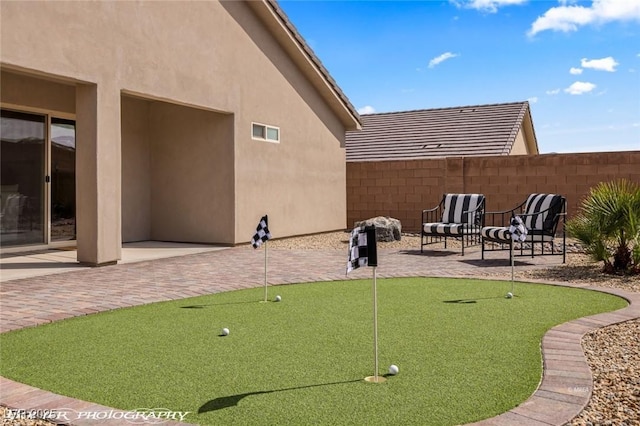 942 Shadow Hawk Rdg, Mesquite, NV 89027 - view of property's community with a patio, a putting green, and fence