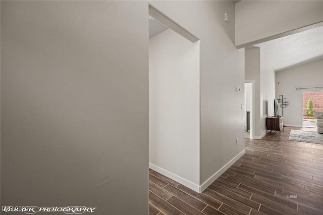 942 Shadow Hawk Rdg, Mesquite, NV 89027 - hallway with baseboards, dark wood-style floors, and vaulted ceiling