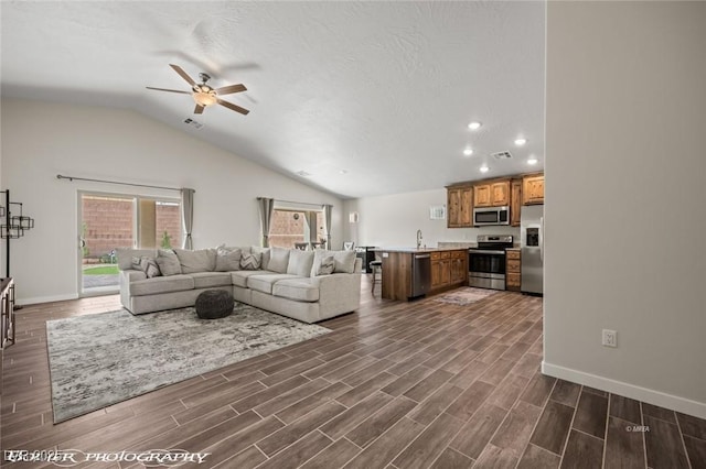942 Shadow Hawk Rdg, Mesquite, NV 89027 - living area featuring a ceiling fan, lofted ceiling, recessed lighting, baseboards, and dark wood-type flooring