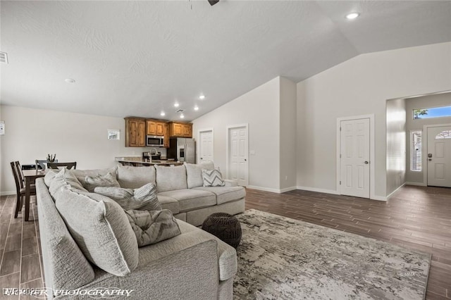 942 Shadow Hawk Rdg, Mesquite, NV 89027 - living area featuring vaulted ceiling, dark wood-style floors, recessed lighting, and baseboards