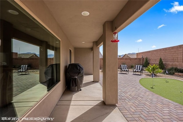 942 Shadow Hawk Rdg, Mesquite, NV 89027 - view of patio featuring a putting area and a fenced backyard
