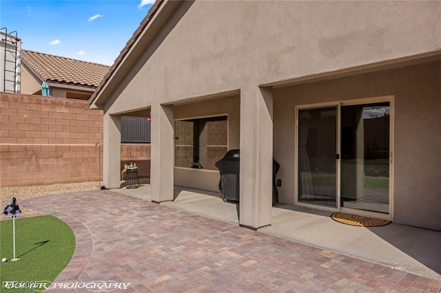 942 Shadow Hawk Rdg, Mesquite, NV 89027 - view of patio / terrace featuring a putting green, fence, and area for grilling