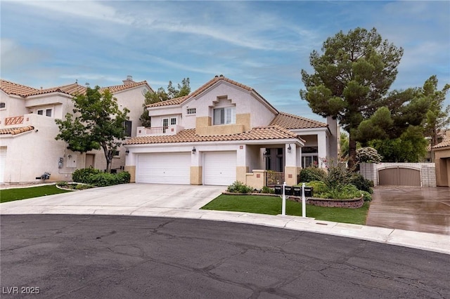 53 Grossinger Ct, Henderson, NV 89074 - mediterranean / spanish-style home featuring driveway, a gate, stucco siding, a tile roof, and a garage