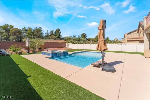 view of pool featuring a patio and a pool with connected hot tub