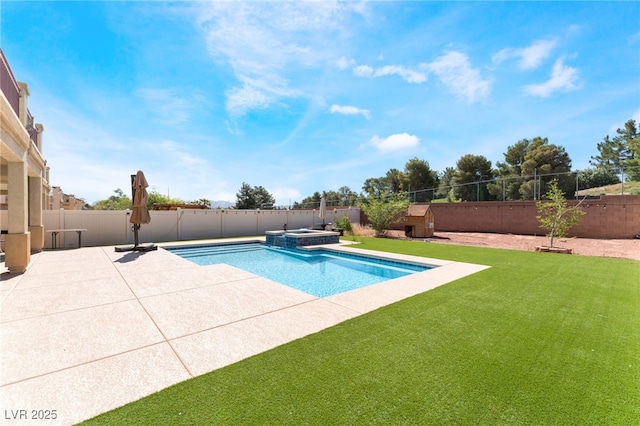 view of pool featuring a patio and a pool with connected hot tub