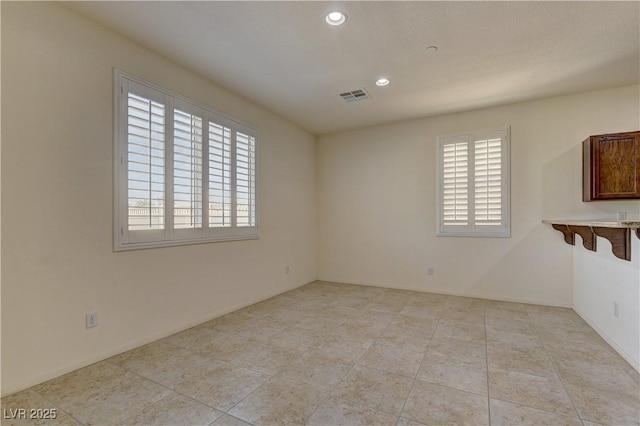 952 Crescent Falls St, Henderson, NV 89011 - spare room featuring recessed lighting, light tile patterned floors, and baseboards