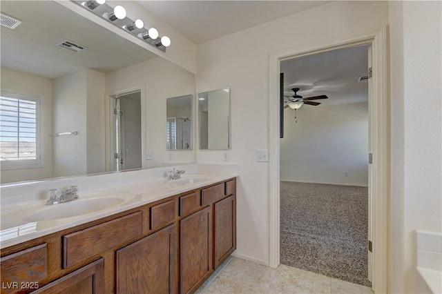 952 Crescent Falls St, Henderson, NV 89011 - bathroom featuring ceiling fan, double vanity, and tile patterned flooring
