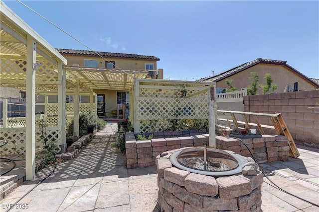 952 Crescent Falls St, Henderson, NV 89011 - view of patio with a fire pit and fence