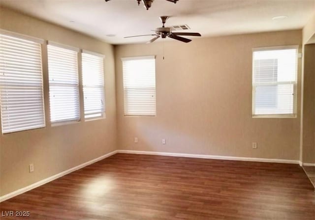 7563 Captain Lord Ct, Las Vegas, NV 89166 - empty room with a ceiling fan, wood finished floors, and baseboards