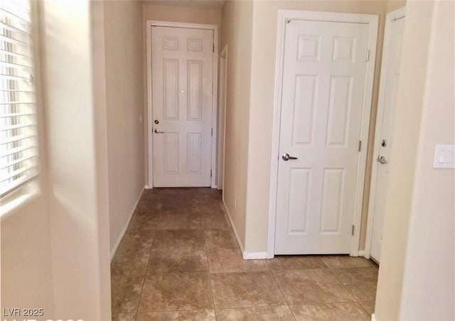 7563 Captain Lord Ct, Las Vegas, NV 89166 - hallway featuring baseboards