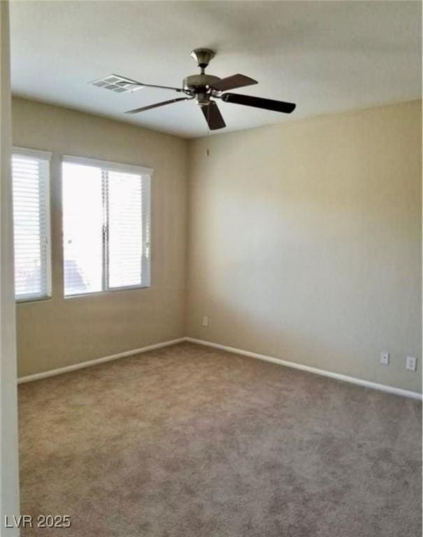 7563 Captain Lord Ct, Las Vegas, NV 89166 - unfurnished room with baseboards, a ceiling fan, and carpet