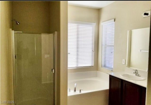 7563 Captain Lord Ct, Las Vegas, NV 89166 - bathroom featuring a stall shower, a bath, and vanity