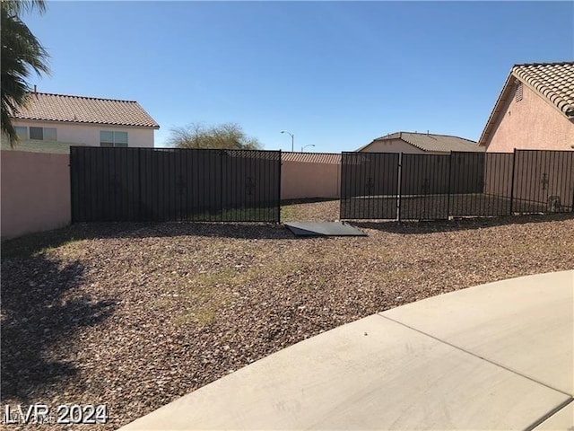 1083 Sterling Peak St, Las Vegas, NV 89110 - view of yard with a gate and fence