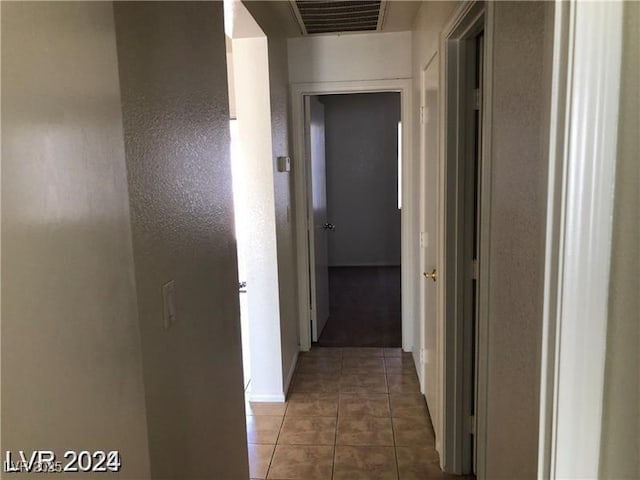 1083 Sterling Peak St, Las Vegas, NV 89110 - hallway featuring tile patterned flooring and baseboards