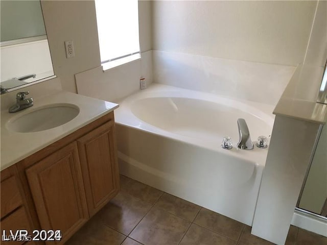 1083 Sterling Peak St, Las Vegas, NV 89110 - full bath with a garden tub, tile patterned floors, vanity, and a shower with door