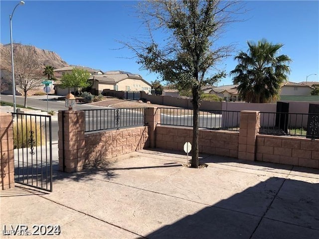 1083 Sterling Peak St, Las Vegas, NV 89110 - view of patio / terrace with a residential view and a gate