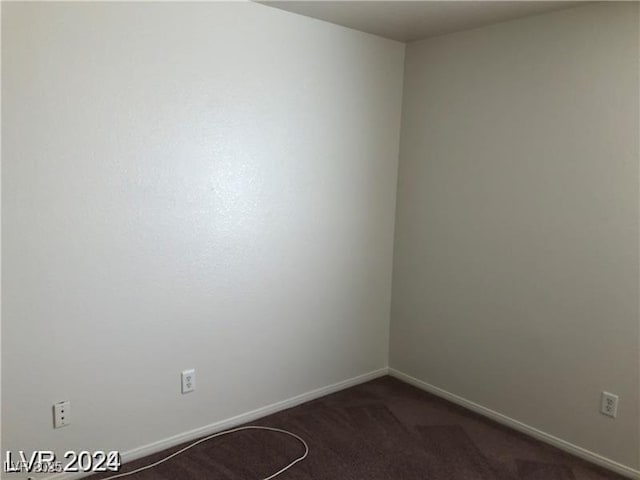 1083 Sterling Peak St, Las Vegas, NV 89110 - empty room featuring dark colored carpet and baseboards