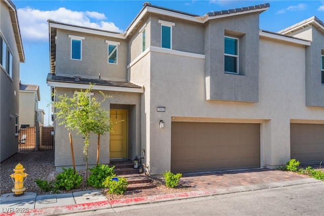 2691 Mango Light Ave, North Las Vegas, NV 89086 - multi unit property featuring an attached garage and stucco siding